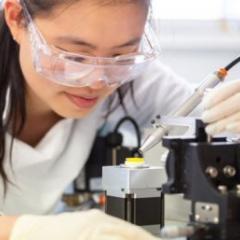 Dr Jovin Choo applying vaccine to the high-density microarray patch (HD-MAP).